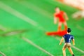 Miniature plastic figure model of soccer player. Royalty Free Stock Photo