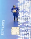 Miniature policeman on the credit card Royalty Free Stock Photo