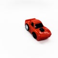 a miniature portrait of a bright red sedan model toy car that looks cool
