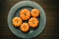 Miniature pumpkins on an aluminum plate charger. autumn fall holiday decor