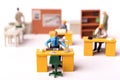 Miniature puppet businesspeople at the office Royalty Free Stock Photo