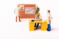 Miniature puppet businesspeople at the office Royalty Free Stock Photo