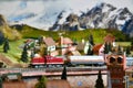 Miniature railway model with model freight train on a mountains ambientation. Toy Train