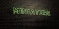 MINIATURE -Realistic Neon Sign on Brick Wall background - 3D rendered royalty free stock image