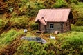 Miniature of realistic rural countryside landscape with a wooden windmill and people Royalty Free Stock Photo