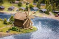 Miniature of realistic rural countryside landscape with a wooden windmill and people