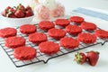 Miniature Red Velvet Cakes with cream cheese frosting and fresh strawberry topping Royalty Free Stock Photo