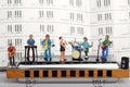 Miniature of a rock band playing on the harmonica Royalty Free Stock Photo