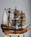 Wooden Model Of A Sailing Ship With Sails On The Masts On White Background For Vertical Story