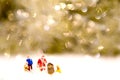 Miniature Santa Claus with snow background.
