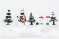Miniature Santa Claus and Snow man make happy hour for children on Christmas day. Royalty Free Stock Photo