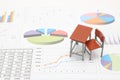 Miniature school study desk and documents with charts and graphs. Royalty Free Stock Photo