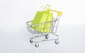 Miniature shopping cart with bags or paper