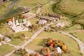 a miniature of a small village and a road. Tiny buildings