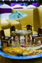 Miniature of table and chair with indian sweet