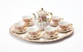 A Miniature Tea Party Set with Cups and Saucers, Isolated -Generative Ai Royalty Free Stock Photo