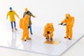 Miniature technical team are monitoring contaminants in micro sh Royalty Free Stock Photo