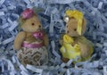 MINIATURE TEDDY BEARS IN FANCY PARTY CLOTHES WITH LACE, HATS, JEWELS, AND RIBBONS Royalty Free Stock Photo