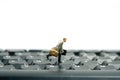 A businessman running above black keyboard carrying briefcase Royalty Free Stock Photo