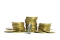 A businessman standing in front of coin money pile. Isolated on a white background Royalty Free Stock Photo