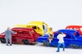 Miniature tiny toys photographer take photos woman sitting on ca Royalty Free Stock Photo