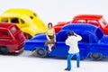 Miniature tiny toys photographer take photos woman sitting on ca Royalty Free Stock Photo