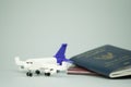Toy airplane and Thai citizen passport and Thailand official passport