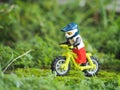 Miniature toy of biker at outdoor. Downhill conceptual design.