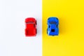 Miniature toy cars on the yellow background top view.automobile and transportation concept