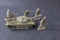 Miniature toy model team soldiers with tank Royalty Free Stock Photo