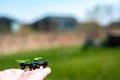 Miniature toy remote controlled drone taking off from a hand Royalty Free Stock Photo
