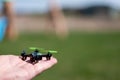 Miniature toy remote controlled drone taking off from a hand Royalty Free Stock Photo