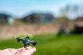 Miniature toy remote controlled drone taking off from a hand Royalty Free Stock Photo