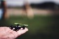 Miniature toy remote controlled drone taking off from a hand Royalty Free Stock Photo