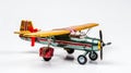 Miniature toy retro airplane with little gift. generated by AI tool.