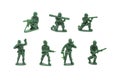 Miniature toy soldiers with guns on white background Royalty Free Stock Photo