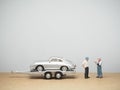 Miniature toy at table with blurred background. Vintage car conceptual design.