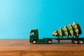 Miniature. Toy truck carries Christmas tree. The concept of Christmas. Empty space for text