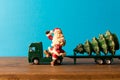 Miniature. Toy truck carries Santa and Christmas tree. The Concept Of Christmas. Empty space for text Royalty Free Stock Photo