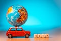 Miniature Toy vintage car carrying a world map balloon and Trip word.Travel and transport concept. Royalty Free Stock Photo