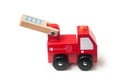 Miniature toy, wooden fire truck on white background Royalty Free Stock Photo