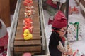 Miniature toys on conveyor belt in shopping center