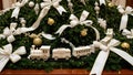 Miniature Train Display Under a Christmas Tree with White Ribbons Royalty Free Stock Photo