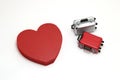 Miniature two suitcases and a red heart on white background. Royalty Free Stock Photo