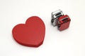 Miniature two suitcases and a red heart on white background. Royalty Free Stock Photo