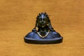 Miniature version of Adiyogi Shiva idol sitting on wooden background