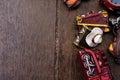 Miniature violin, clocks,travel bag and train on wooden floor