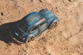 Miniature of a Volkswagen Beetle stuck in the sand. Scale 1:43 Royalty Free Stock Photo