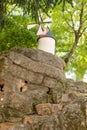 Miniature windmill on top of a hill with rock stairs access