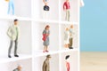 Miniature woman and a group of miniature men. concept of gender discrimination